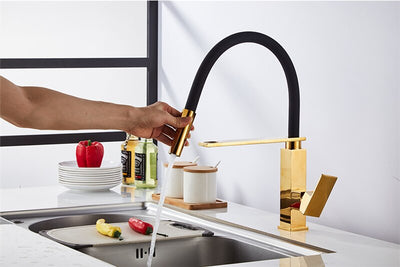 Gold polished kitchen faucet with dual sprayer