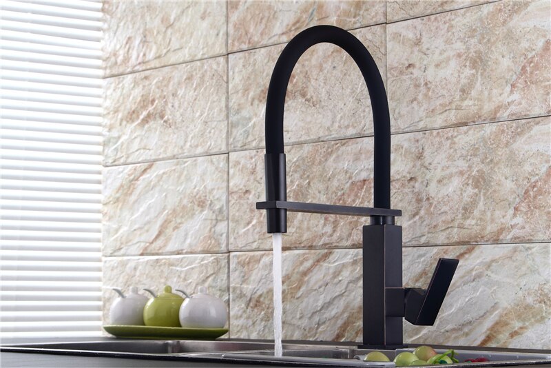 Gold polished kitchen faucet with dual sprayer