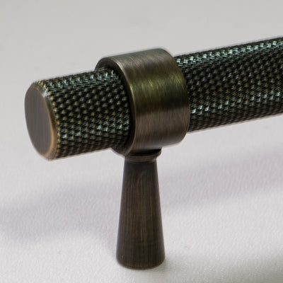 Black with brushed gold cabinet door handles and knobs