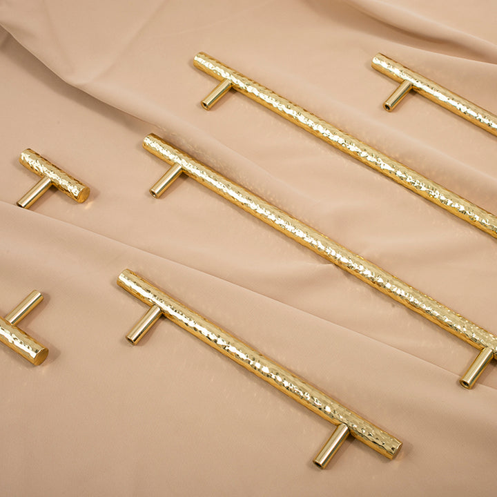 Nordic Gold Polished Hand Hammered Cabinet door handles and knobs.
